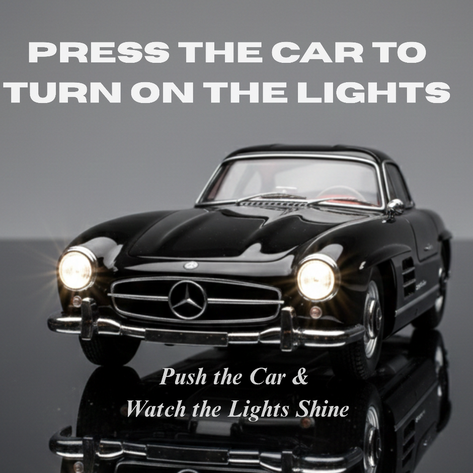 Black die cast classic car showing press to turn on lights feature with text instruction
