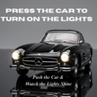 Black die cast classic car showing press to turn on lights feature with text instruction
