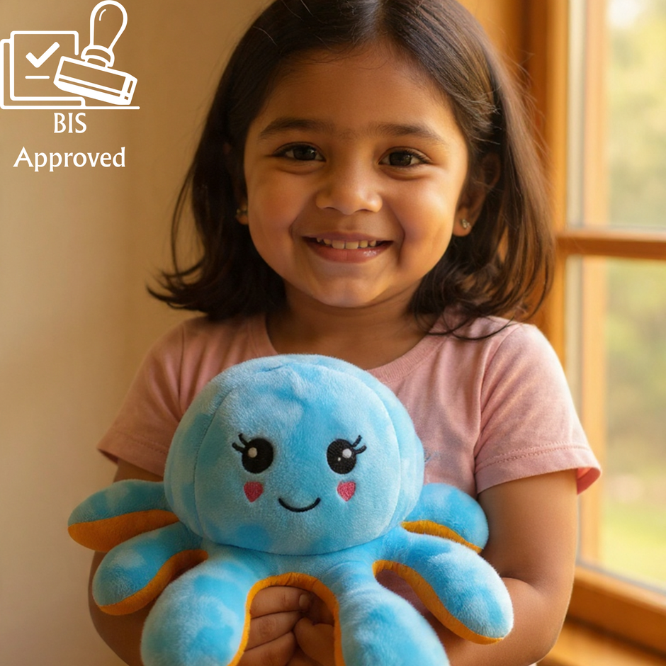Child holding a blue plush toy with a smile, with 'BIS Approved' logo in the corner.