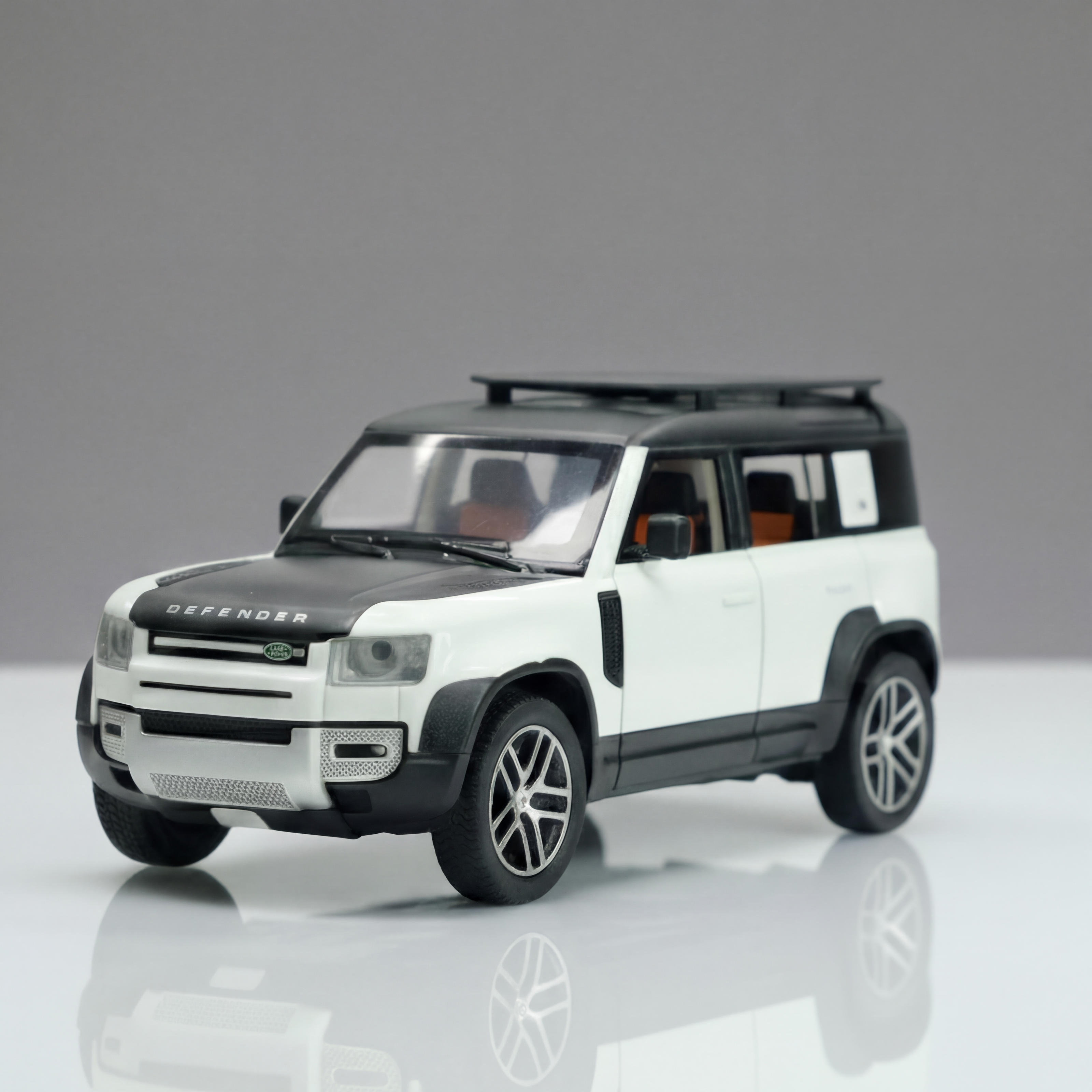Claptales white 1:24 die cast SUV model car on a reflective surface showing detailed front and side design