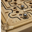 Close-up of wooden maze board handle used to control metal ball, Claptales wooden toy