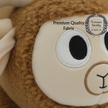 Close up of brown sheep soft toy showing soft fur and cute facial details