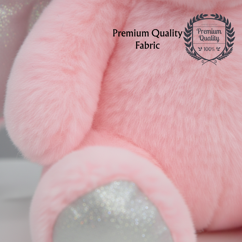 Close up of pink teddy soft toy showing soft plush premium quality fabric 100%
