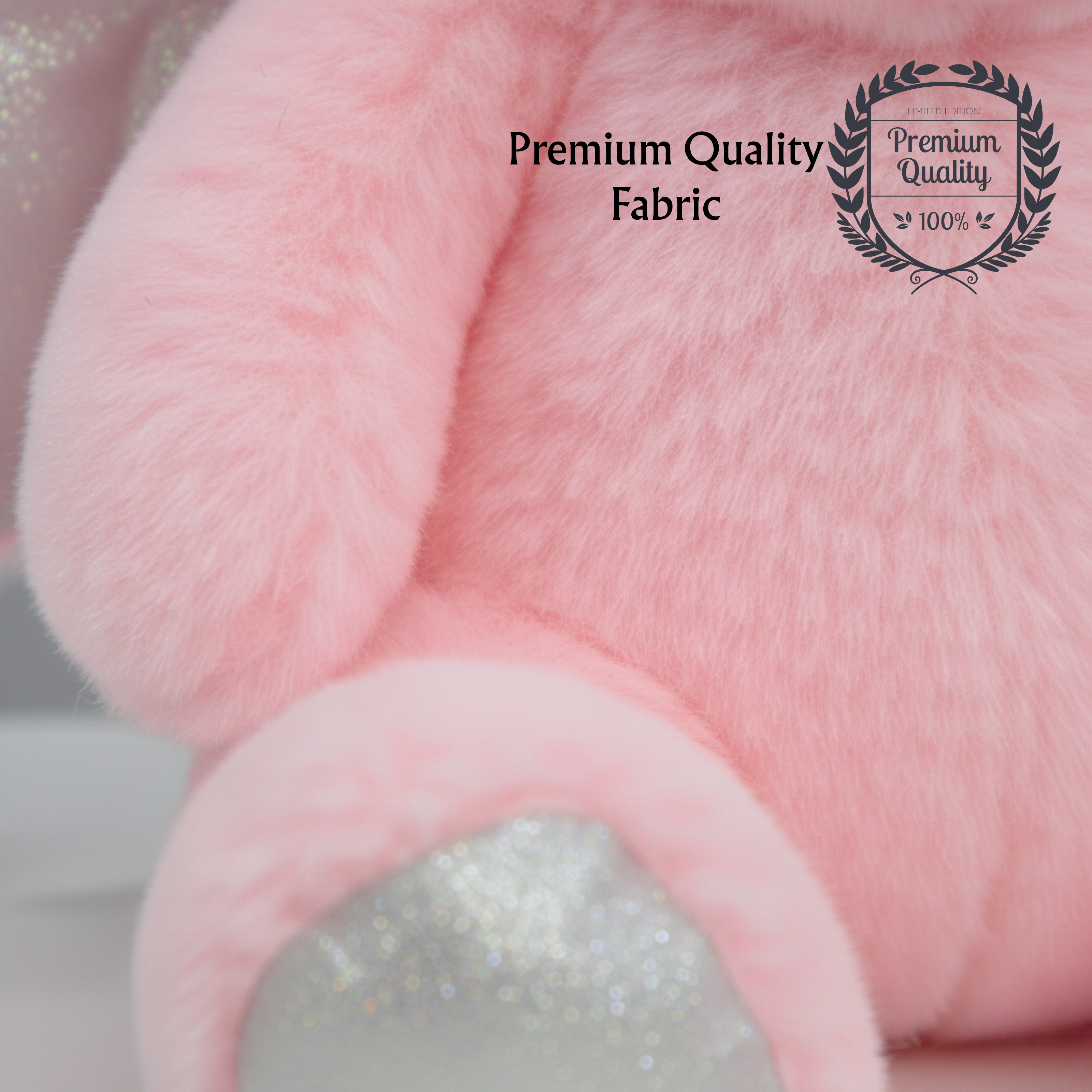 Close up of pink teddy soft toy showing soft plush premium quality fabric 100%