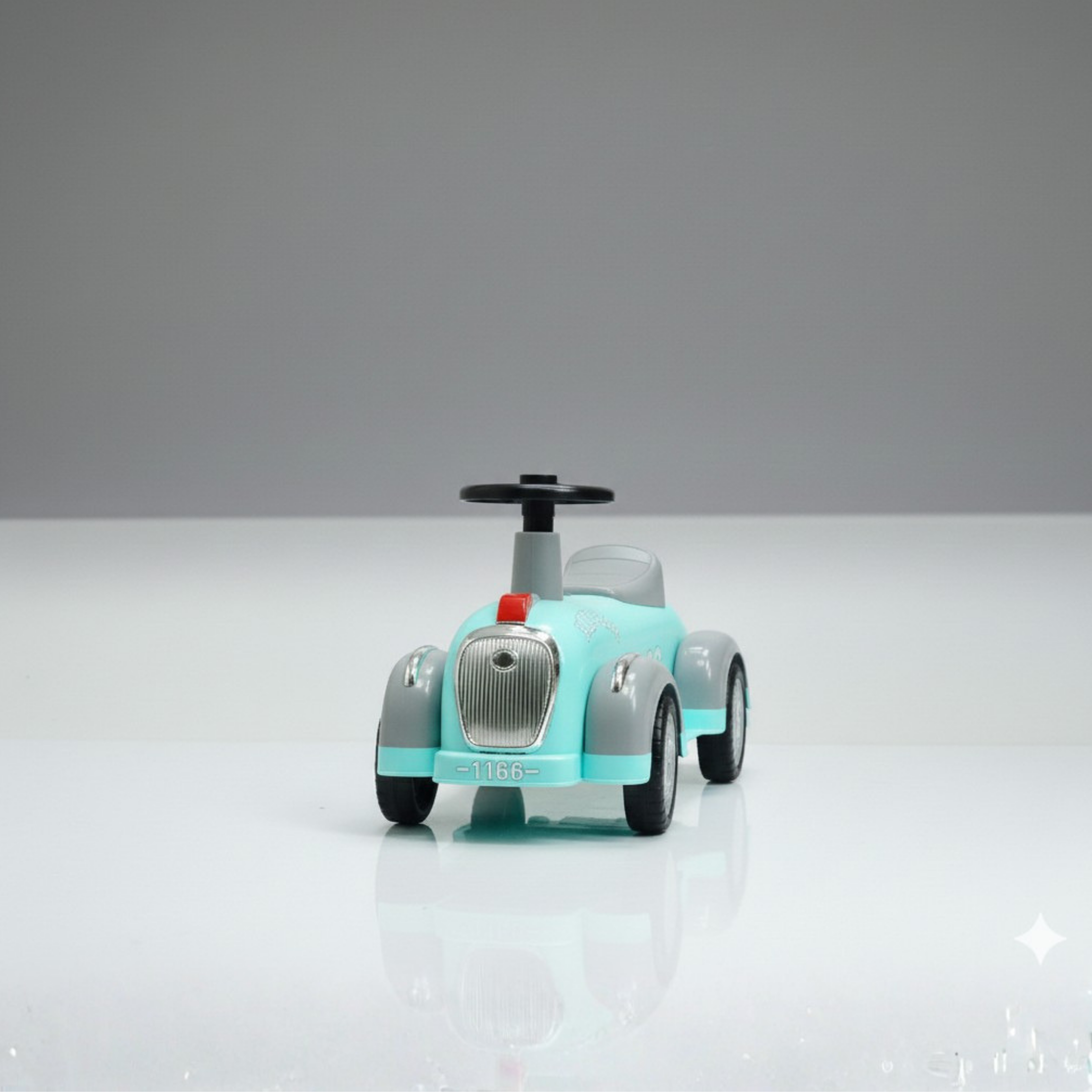 Front view of baby ride on car showing compact design and easy steering handle for toddlers
