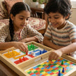 Kids-playing-claptales-wooden-ludo-and-snake-ladders-board-game