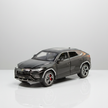 Model car of a luxury SUV on a white background
