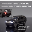Model car with illuminated headlights on a reflective surface, featuring text about car features.