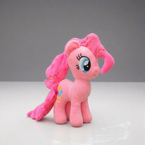 Pink plush toy with a bow on a gray background