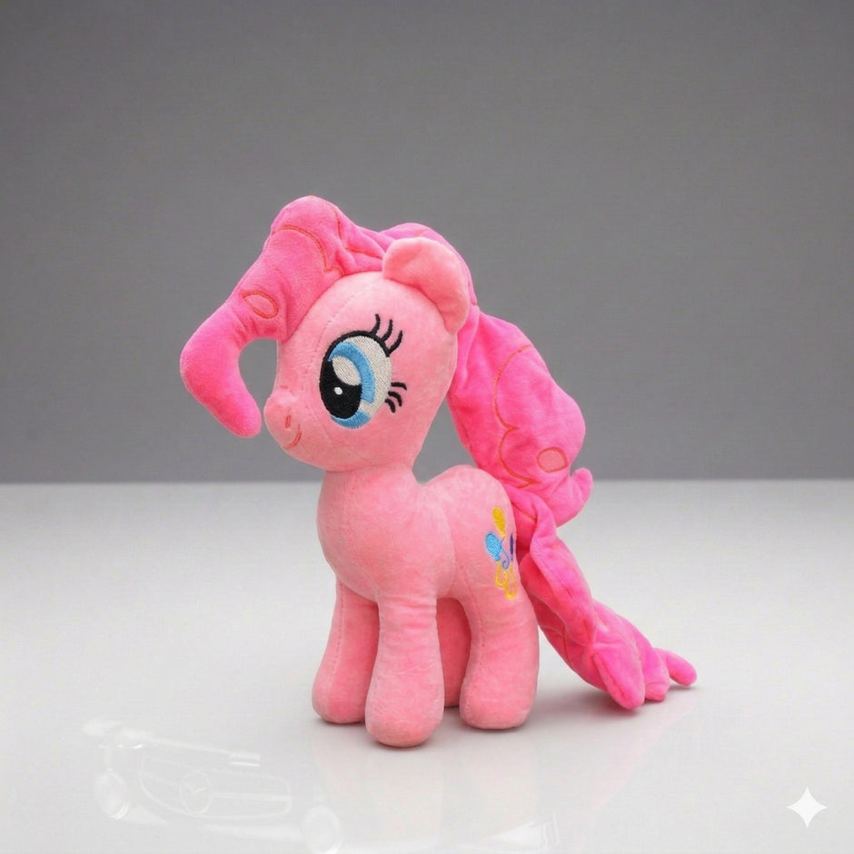 Pink plush toy with a gray background