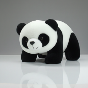 Plush panda toy on a reflective surface with a gray background