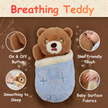 Plush toy bear wrapped in a blue blanket with features highlighted on a brown background.