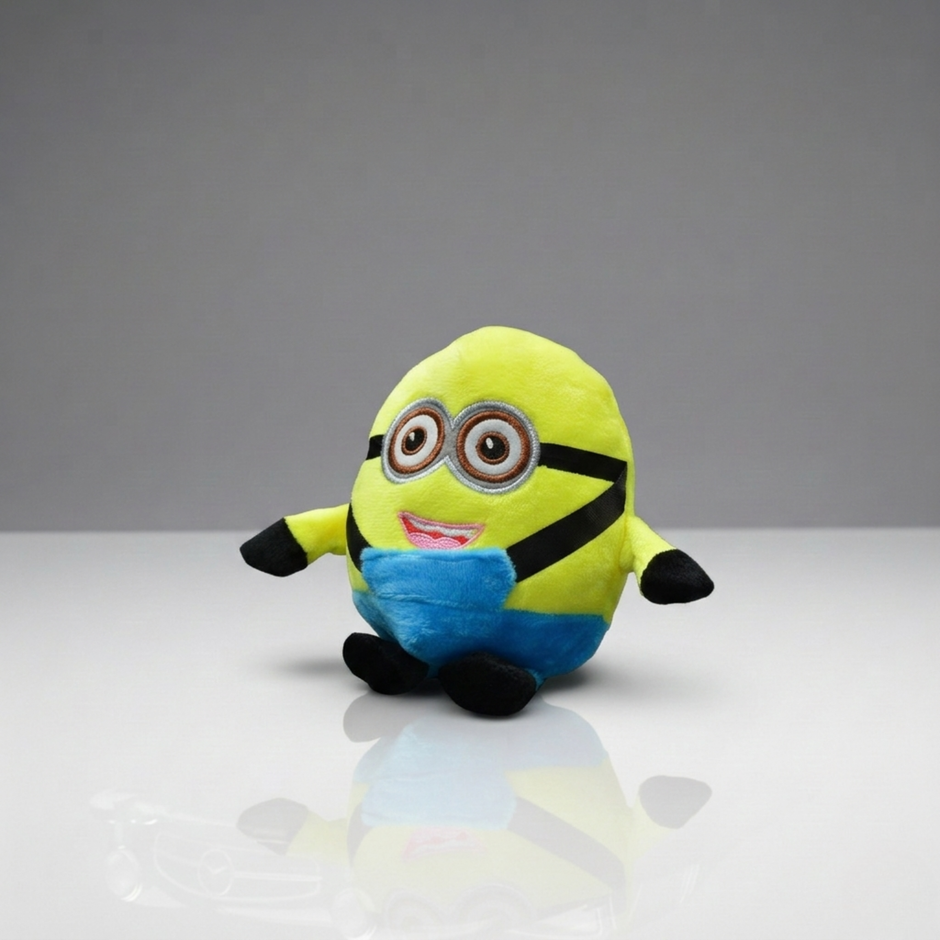 Plush toy resembling a character from a popular movie franchise on a reflective surface with a gray background