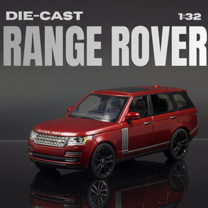 Red die-cast Range Rover model on a reflective surface with a dark background