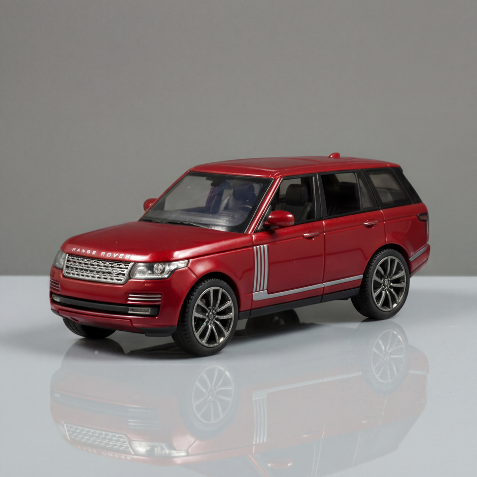 Red model car on a reflective surface with a gray background
