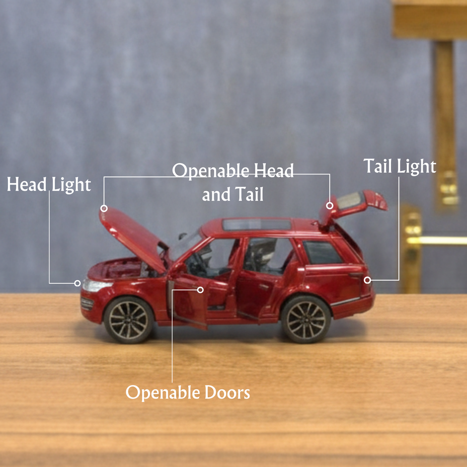 Red toy car with labeled features on a wooden surface