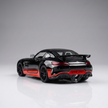 Side view of Claptales black 1:24 die cast sports car with red side detailing

